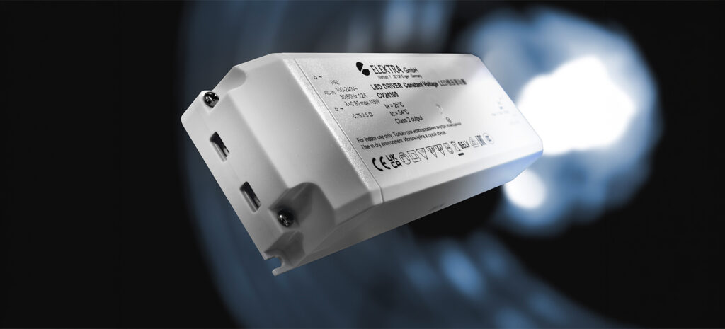 Der ELEKTRA LED-Treiber, präsentiert vor einem sanften Lichtspiel, zeigt effiziente Technologie für moderne Beleuchtungssysteme.