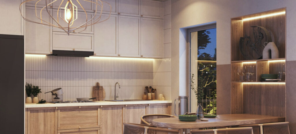 Moderne Küche mit warmem Licht, Holzdetails und stilvoller Beleuchtung, die den Raum gemütlich und einladend gestaltet.