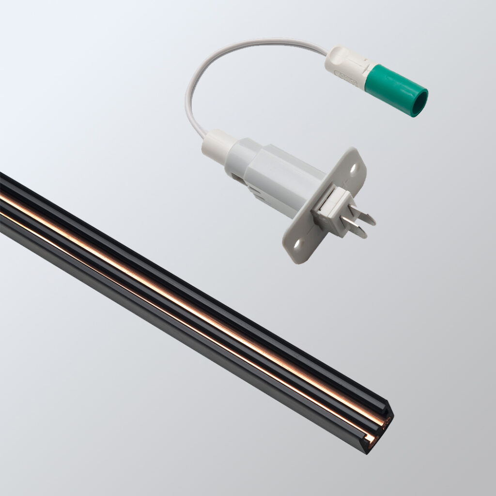 Detailaufnahme einer Vario-Stromschiene mit einem Stromabnehmer, ideal für moderne Beleuchtungslösungen.